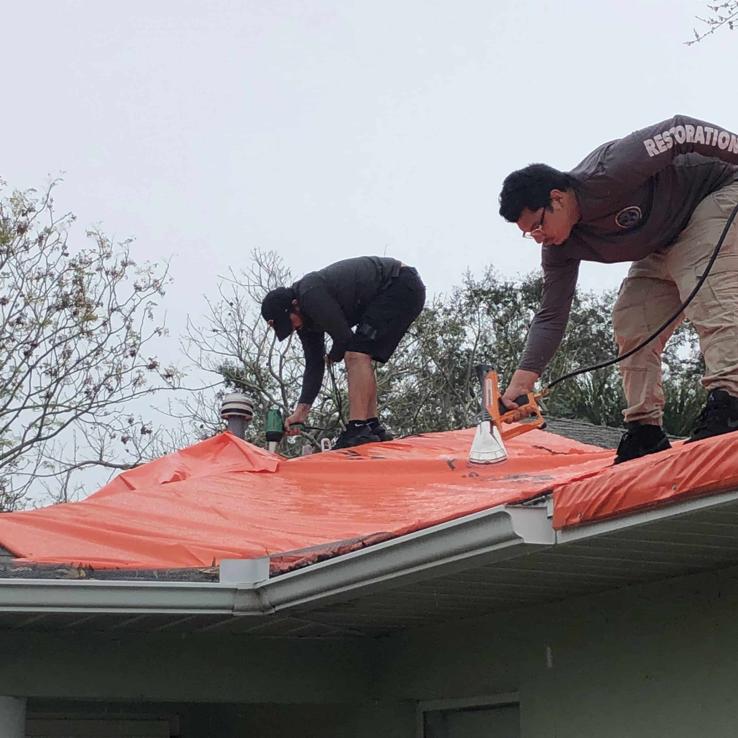 Hurricane Ian Restoration: OTM Offering 24/7 Emergency Services - On The Map Restoration roof tarping to prevent water damage to home in Florida.